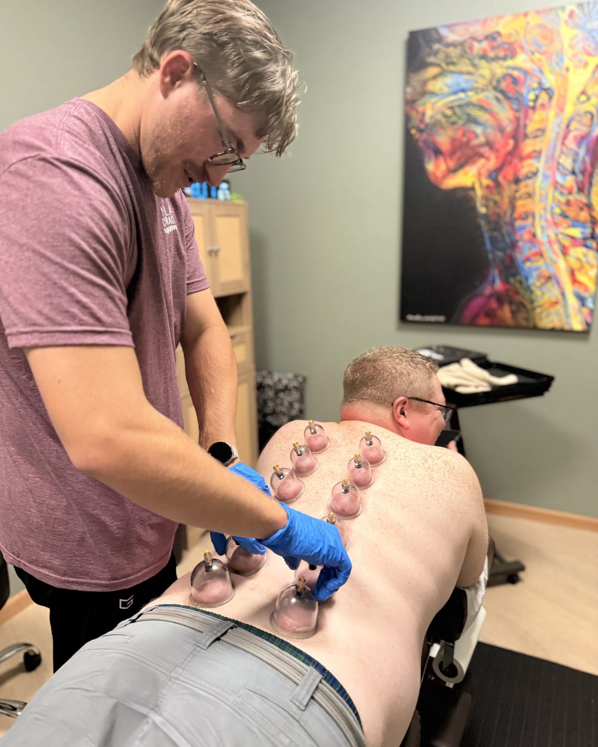 Dr. Matt applying cupping therapy to a patient