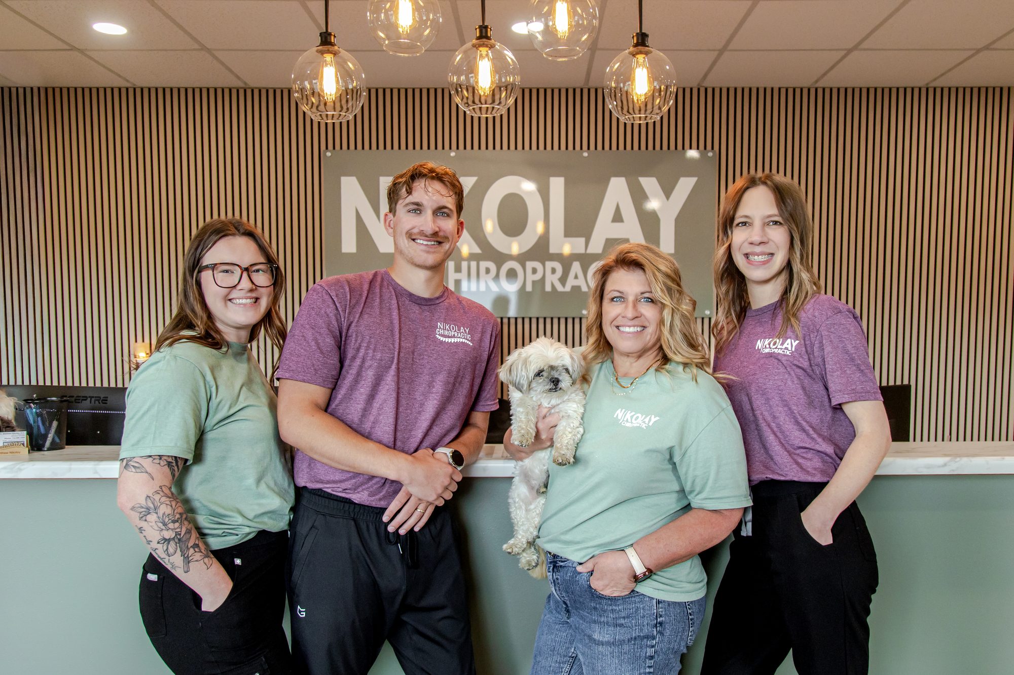 The Nikolay Chiropractic team at the front desk