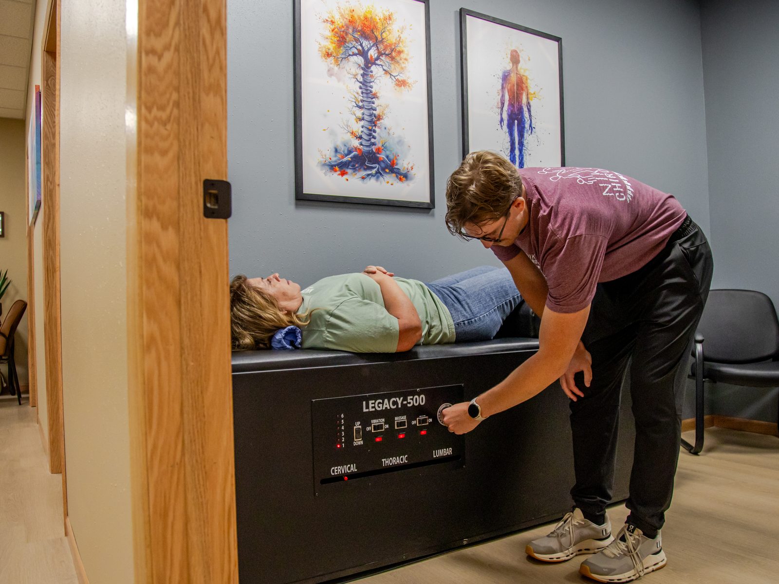 Dr. Matt running the intersegmental traction table for a patient